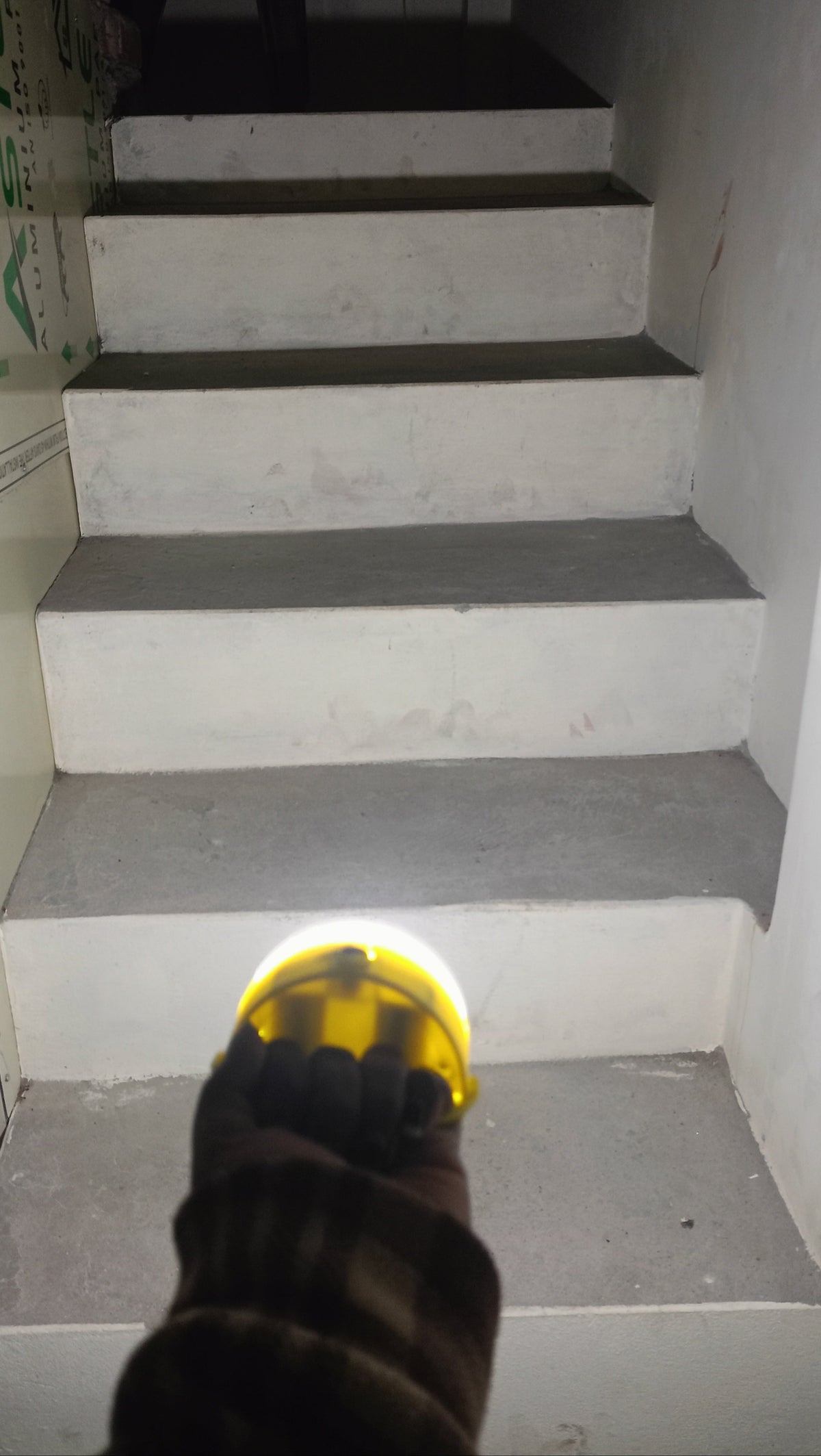 Person using the Soul Light on the stairs
